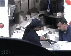 FedEx worker throws box at colleague
