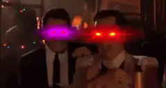 Two men with glowing laser eyes