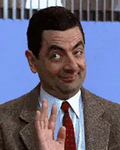 Mr. Bean smirking and waving