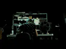 man throws film reel