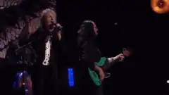 Paul McCartney and bassist performing on stage
