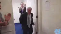 Man enters locker room to cheering team