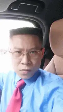 Man in car looking at camera