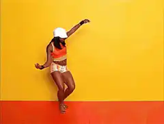 Woman in orange and white dancing