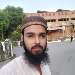 Man with beard and cap looking sideways