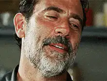 Negan licking lips and smiling