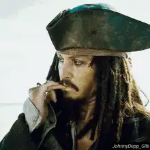 Jack Sparrow thinking with finger on lips