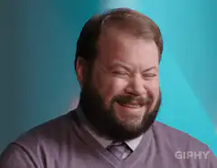 Dan Harmon squinting and smiling