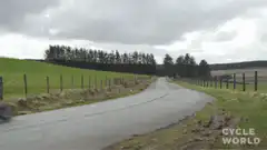 Motorcycle riding down country road