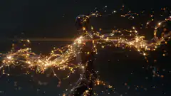 glowing wireframe human figure with light particles