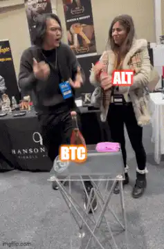 Man catches bottle labeled BTC while woman holds ALT