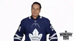Man in Toronto Maple Leafs jersey gives thumbs down