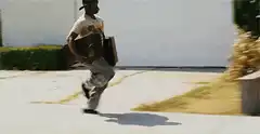 Man running with suitcases