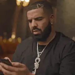 Drake looking at phone saying wow
