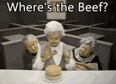 Three elderly women inspect a hamburger bun
