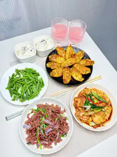 Korean-style meal with beef, tofu, and greens
