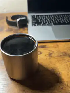 steaming coffee cup on desk