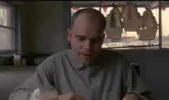 Norman Bates looking at a drink