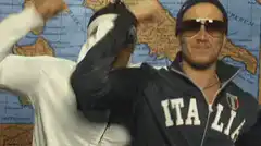 Two men in Italia jackets dancing