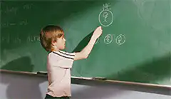boy draws mc on chalkboard