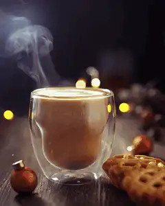 Steaming coffee with Christmas decorations