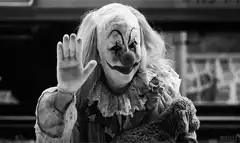 creepy clown waving hello