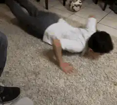 Man doing pushups on carpet and tile