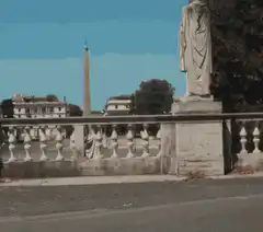Man riding yellow scooter in Rome