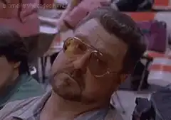 John Goodman squinting in sunglasses