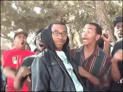 Man screaming with hands on face