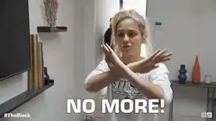 Woman crossing arms saying no more