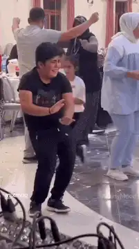 Boy dancing energetically at a party