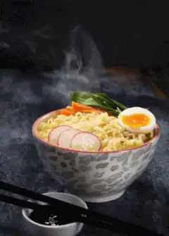 Steaming bowl of ramen noodles