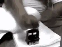 Hand rapidly stamping a small object