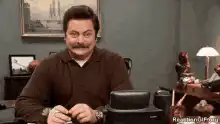 Ron Swanson nodding with a smirk