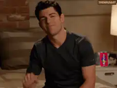 Nick Jonas nodding and pointing