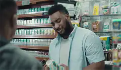 Man in store asks about price on can