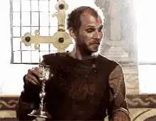Tywin Lannister raises a goblet