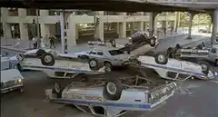 Police cars crash and tumble