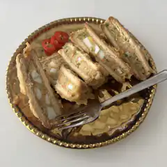 Egg salad sandwiches on gold plate