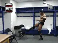 Wrestler kicks chair in locker room