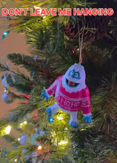 Yeti ornament swinging on Christmas tree