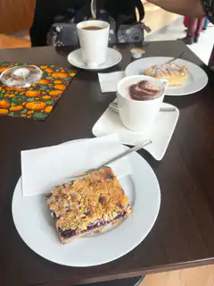 coffee and crumble cake on table