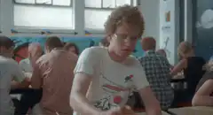 Boy peeling potato in school cafeteria