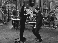 Wednesday Addams and Gomez Addams dancing