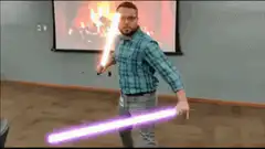 Man with lightsabers in front of fireplace