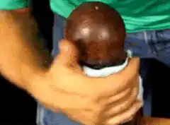 Hand wiping a wooden pepper grinder