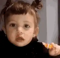 Toddler eating candy corn