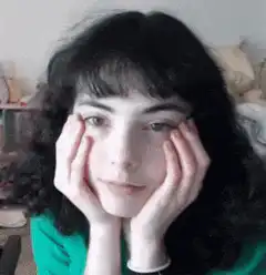 woman resting chin on hands looking around