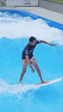 Man surfing on a wave pool machine
